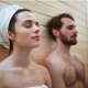 a man and a woman are having a rest after taking a sauna shower
